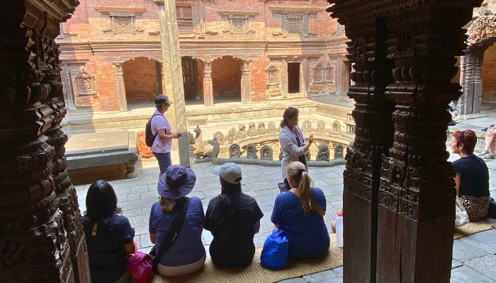 Group sitting in ancient temple Kathmandu