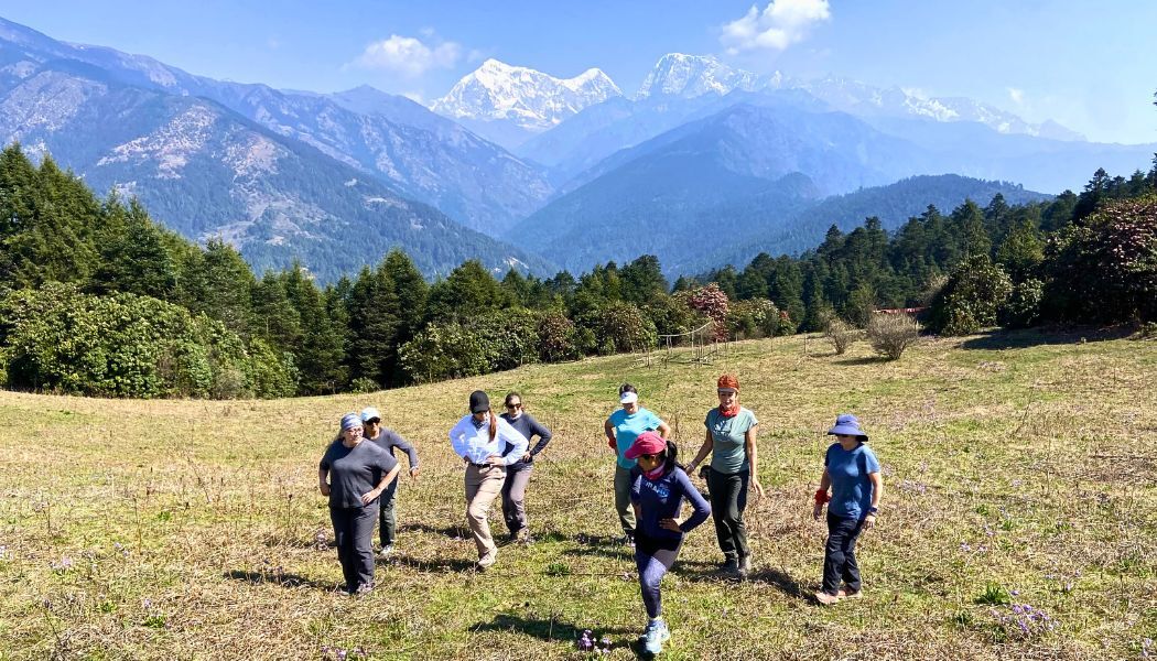 Group warm up dance with Everest views in background-1